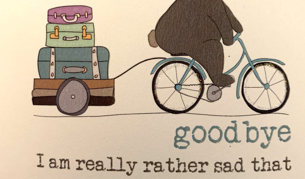 bear riding a bicycle saying goodbye